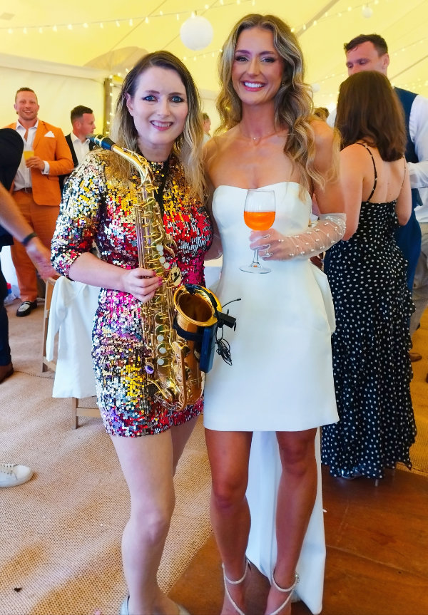 Clare, wedding saxophone player with with a bride